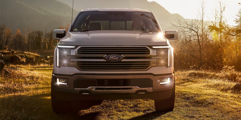A photo of the front grille of a white 2024 Ford F-150