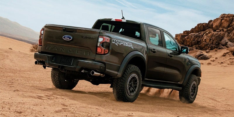 A photo of the 2024 Ford Ranger driving in the desert.