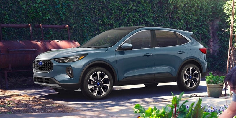 A photo of a 2024 Ford Escape parked under a tree