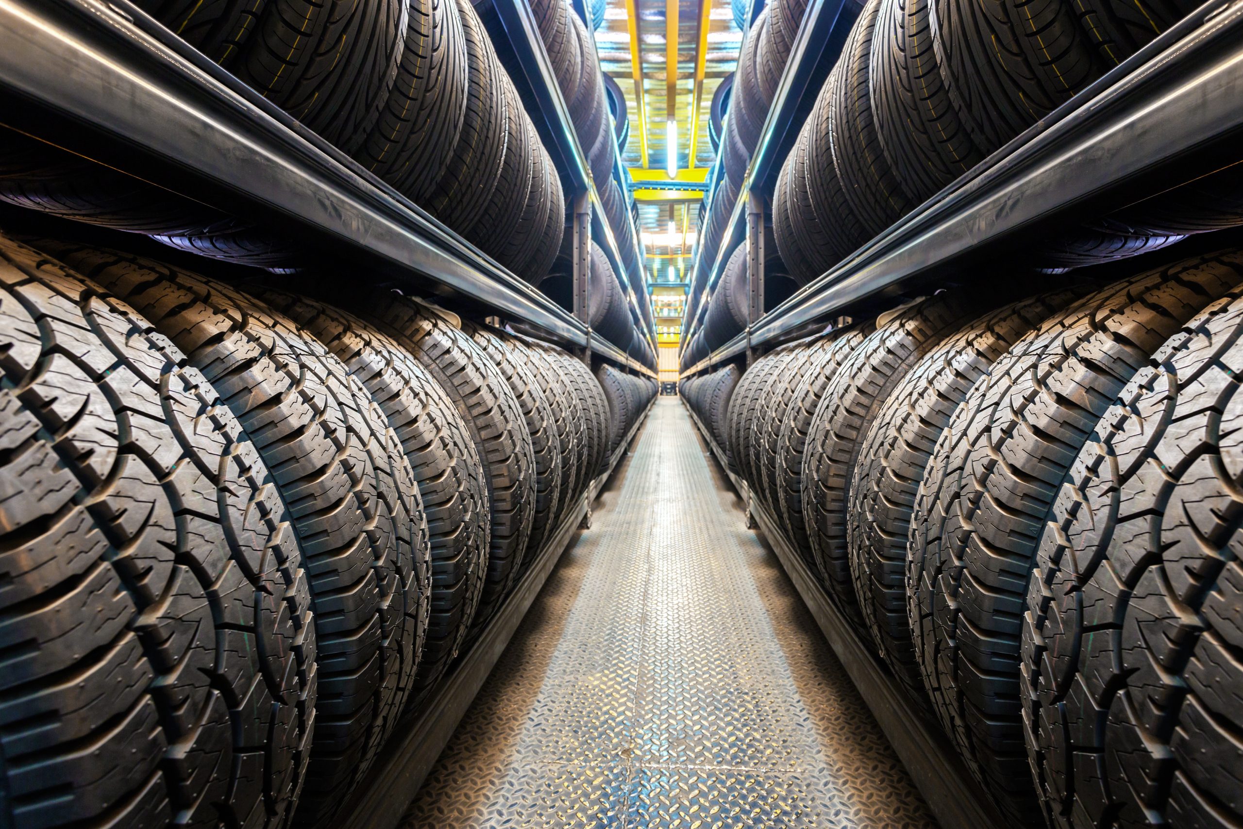 Rows of tires at a tire store.