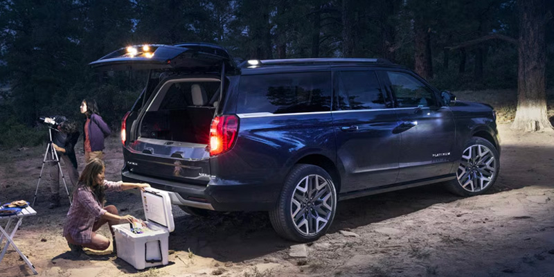 A photo of a 2025 Ford Expedition being loaded with gear.