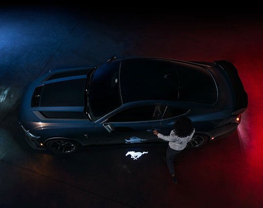 2024 Ford Mustang® Dark Horse™ model with a driver approaching the vehicle | Pohanka Ford of Salisbury in Salisbury MD